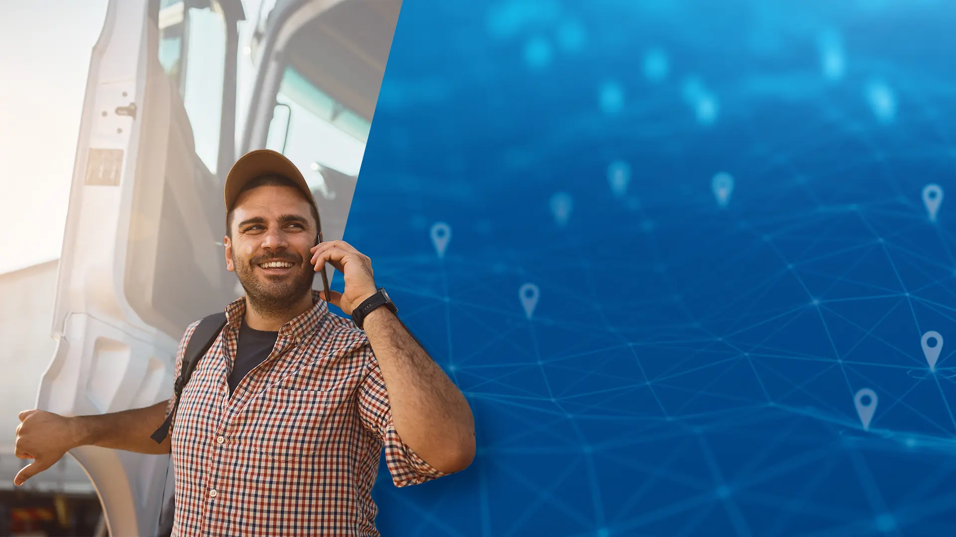 Smiling fleet driver on the phone beside a truck with a blue GPS location tracking graphic overlay
