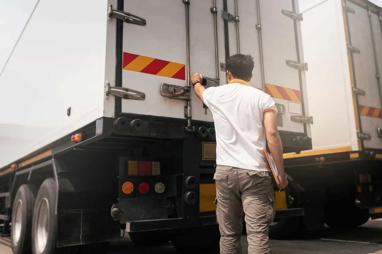 Worker locking a truck