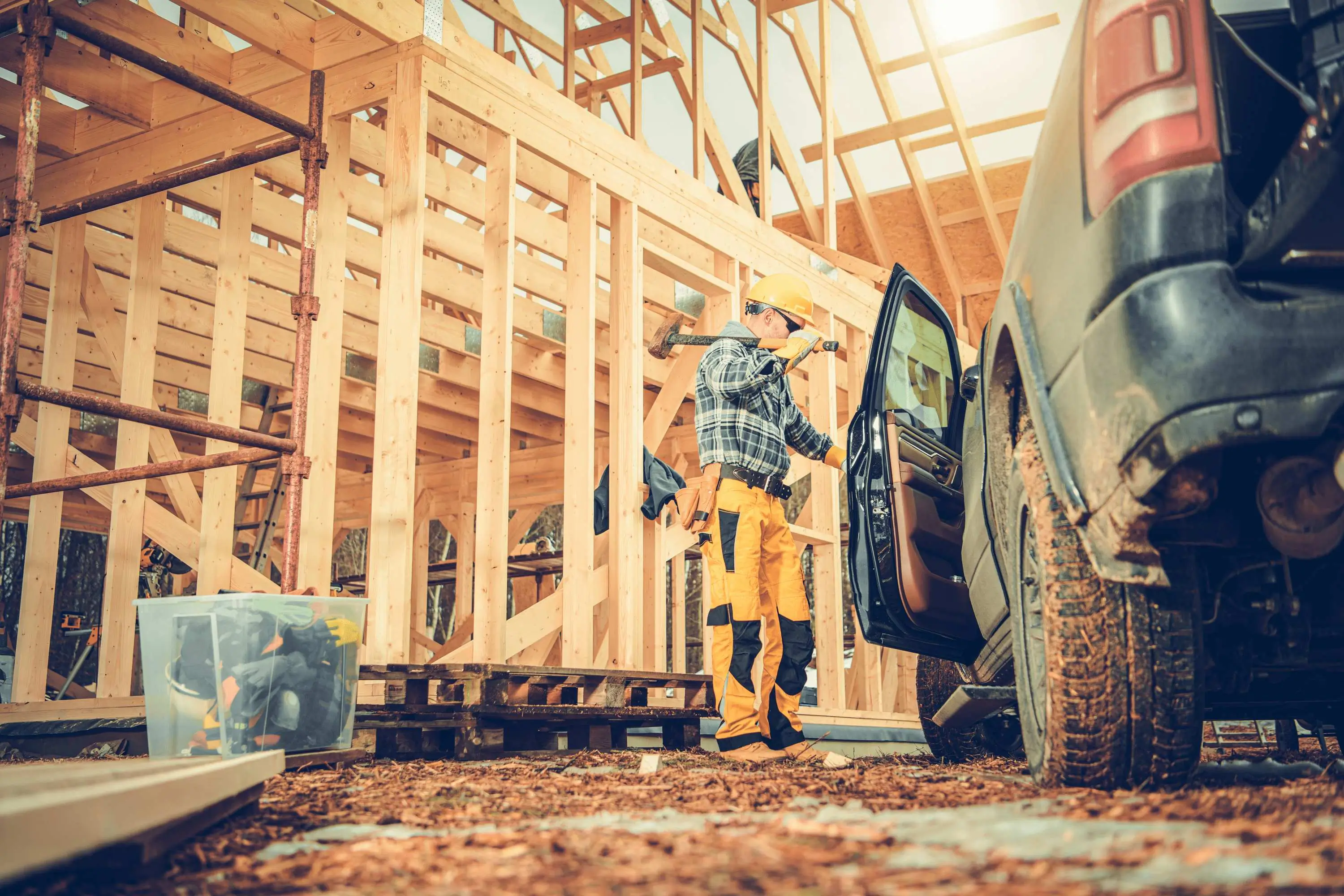 Landscaper grabbing tools inside their vehicle