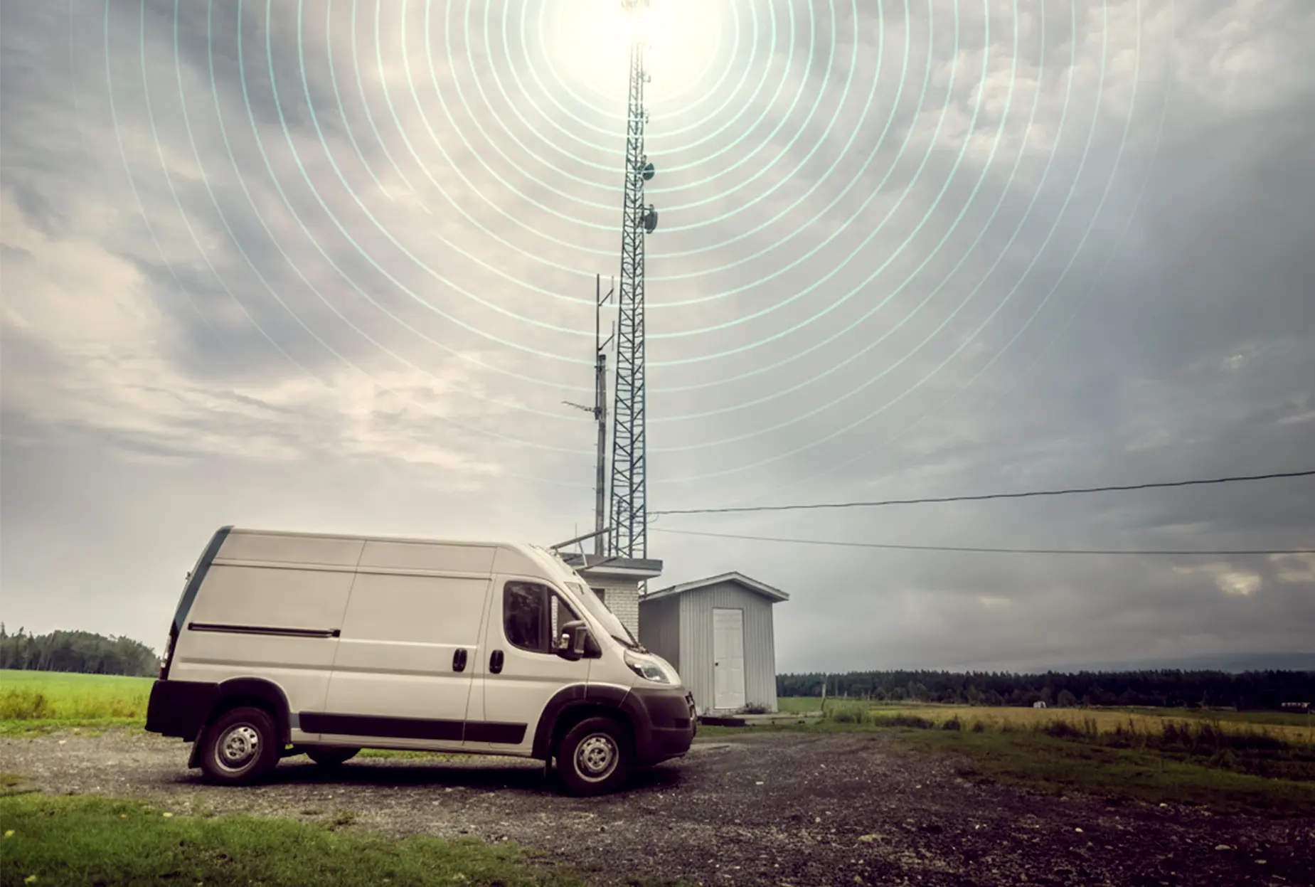 Van next to cell tower with signal bars