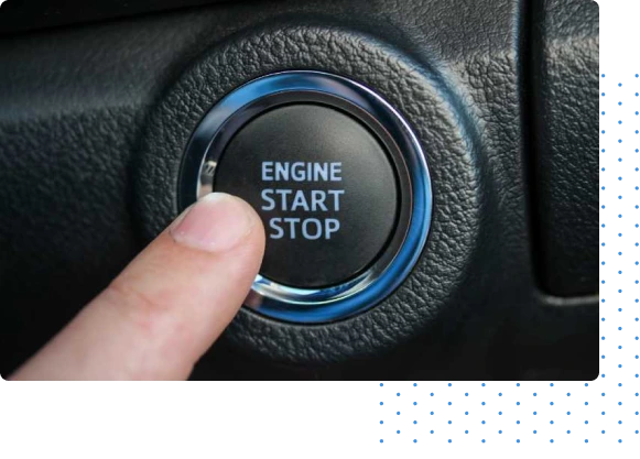 Person trying to press push to start button in a vehicle