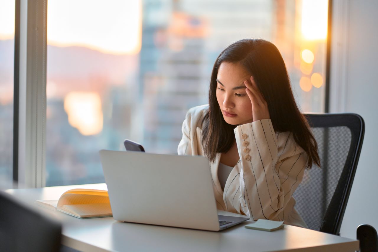 Fleet Manager frustrated at her desk