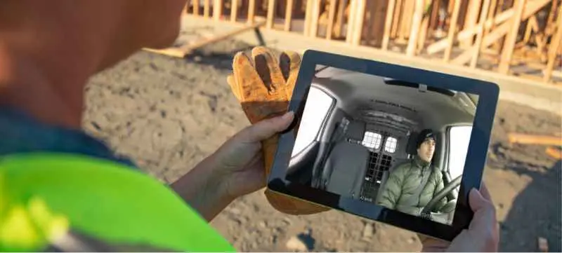 Person watching raven dashcam on a tablet